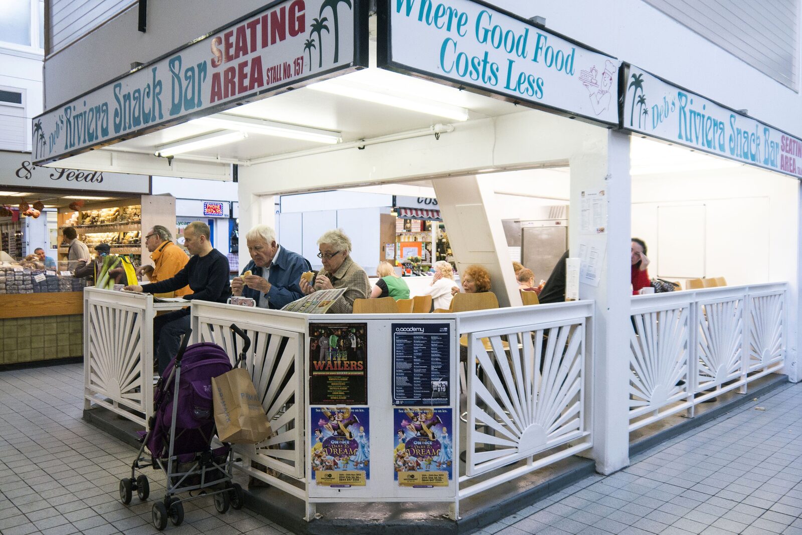 Shoppers eating at Deb's Riviera Snack Bar inside Sheffield's Castle Market in 2013