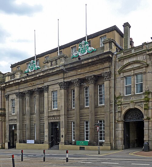 The classical stone front of the Cutlers' Hall on Church Street, Sheffield.