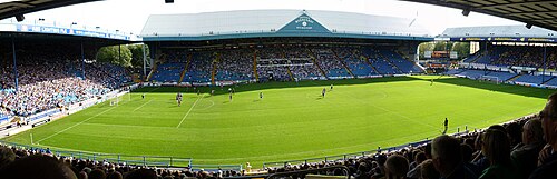 Hillsborough stadium seen from outside, with its stands above the surrounding houses.