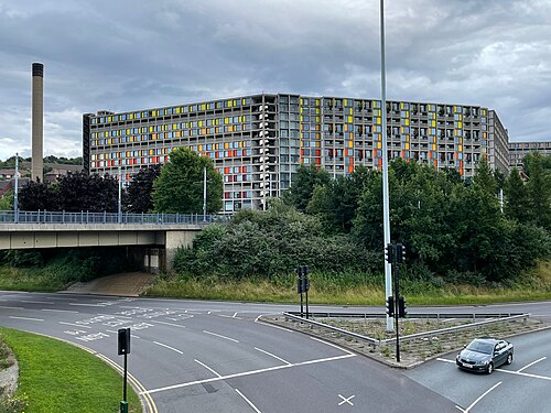 The Park Hill flats on their hill above Sheffield, part restored in bright colours.