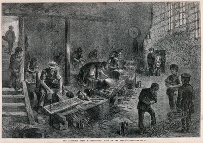 Men and boys working in a fork-grinding factory in Sheffield. Wood engraving by M. Jackson after J. Palmer, 1866